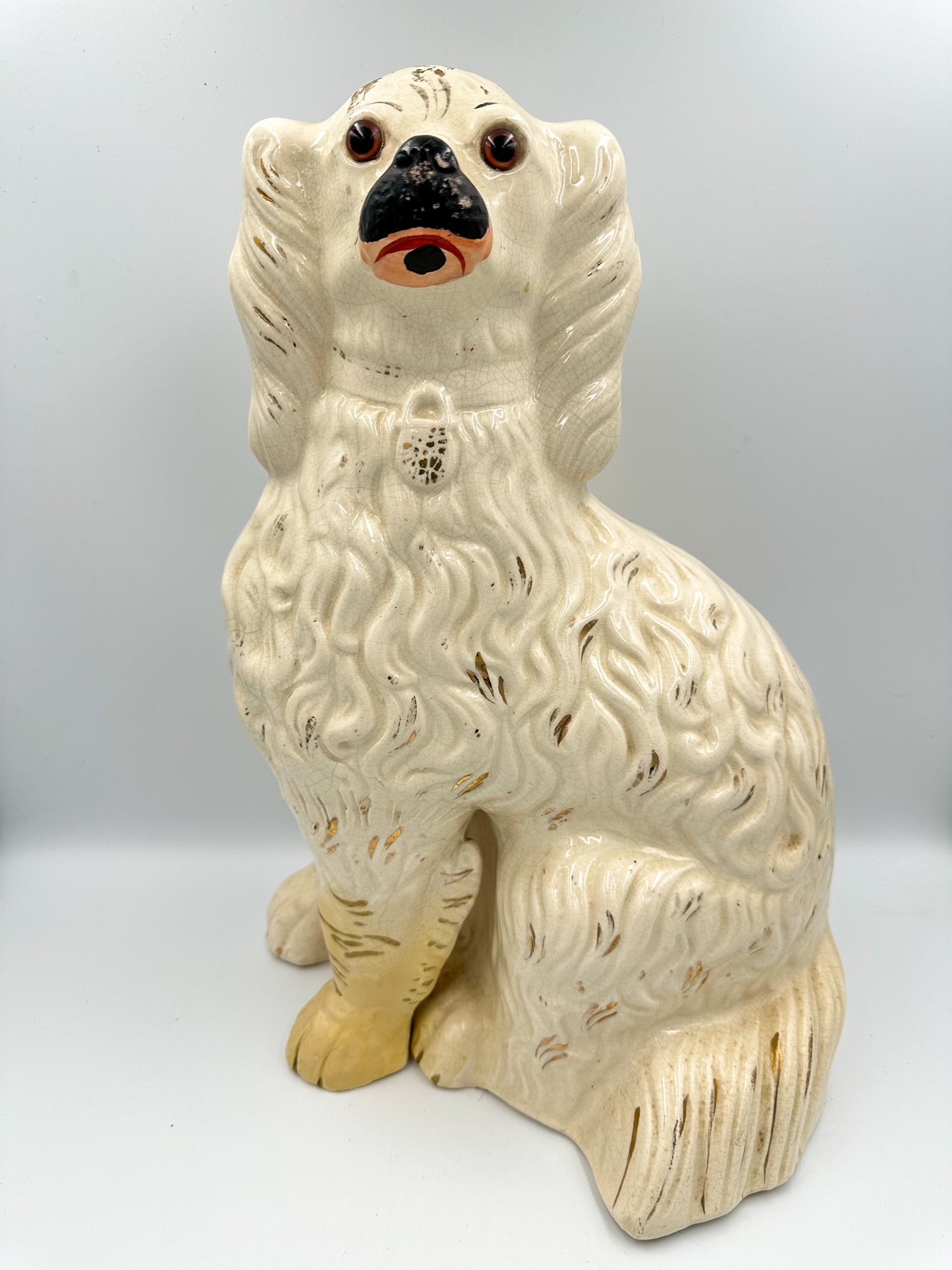 Extra large white Staffordshire Spaniel with black snout and glass eyes