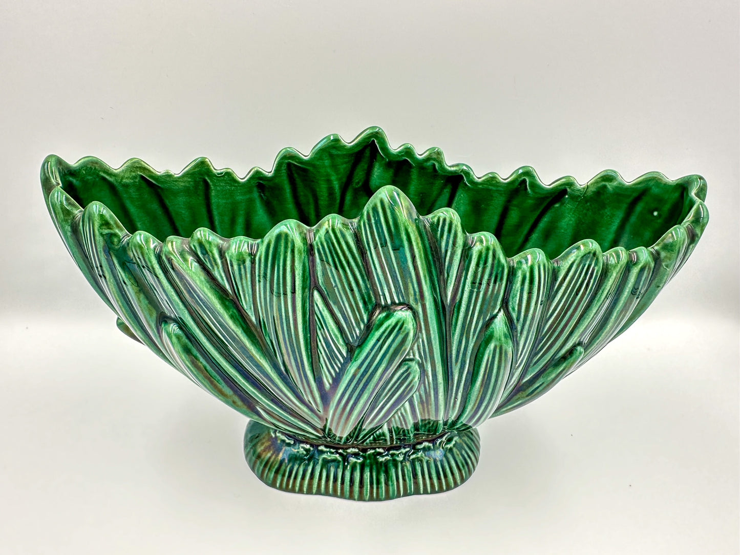 A vintage green glass Sylvac 'Hyacinth' mantle vase with a floral pattern, displaying a bulbous body and a flared rim, placed against a white background.
