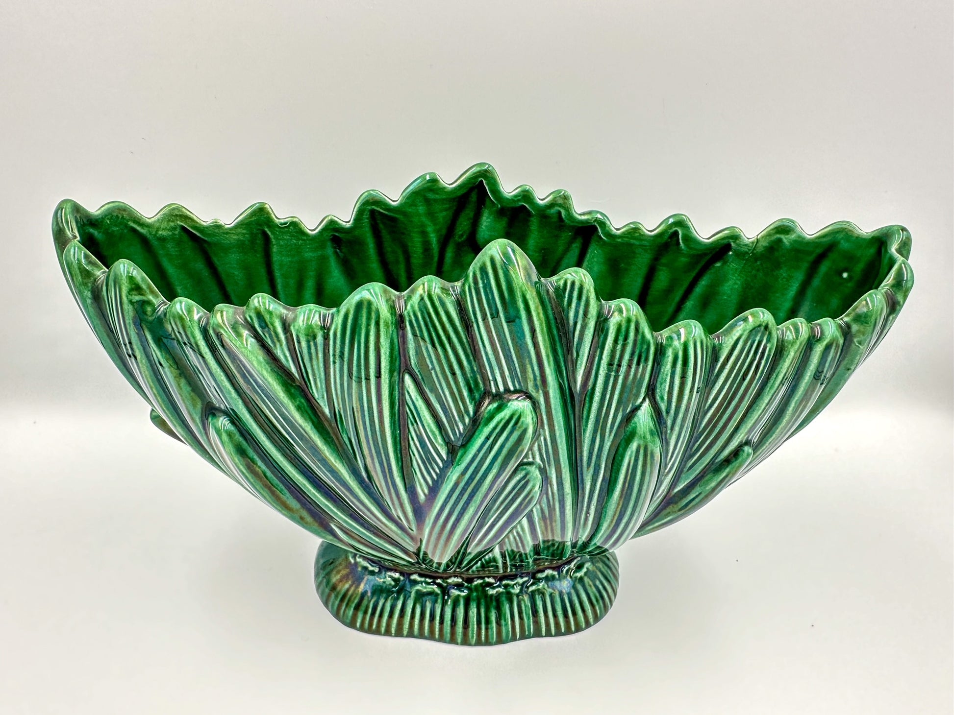A vintage green glass Sylvac 'Hyacinth' mantle vase with a floral pattern, displaying a bulbous body and a flared rim, placed against a white background.