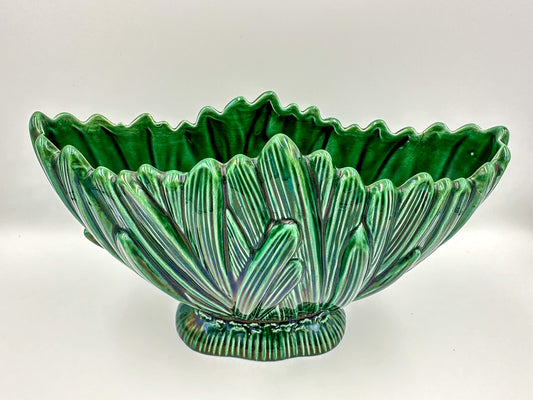 A vintage green glass Sylvac 'Hyacinth' mantle vase with a floral pattern, displaying a bulbous body and a flared rim, placed against a white background.