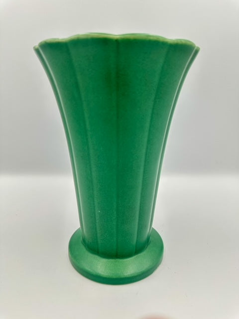 A green ceramic vase with a geometric pattern, designed by Keith Murray for Wedgwood.