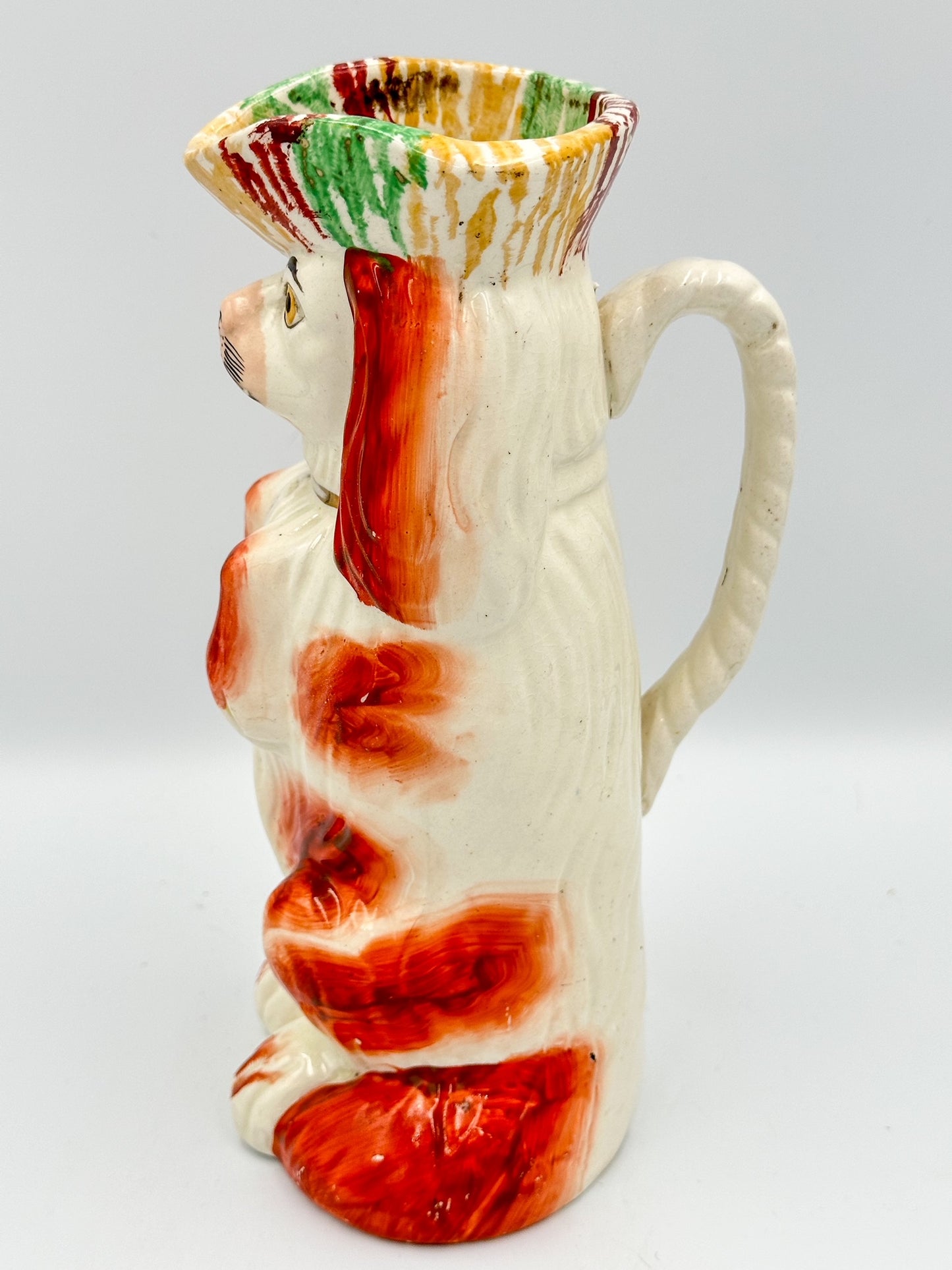 Begging Staffordshire Dog Pitcher w/ Striped Hat