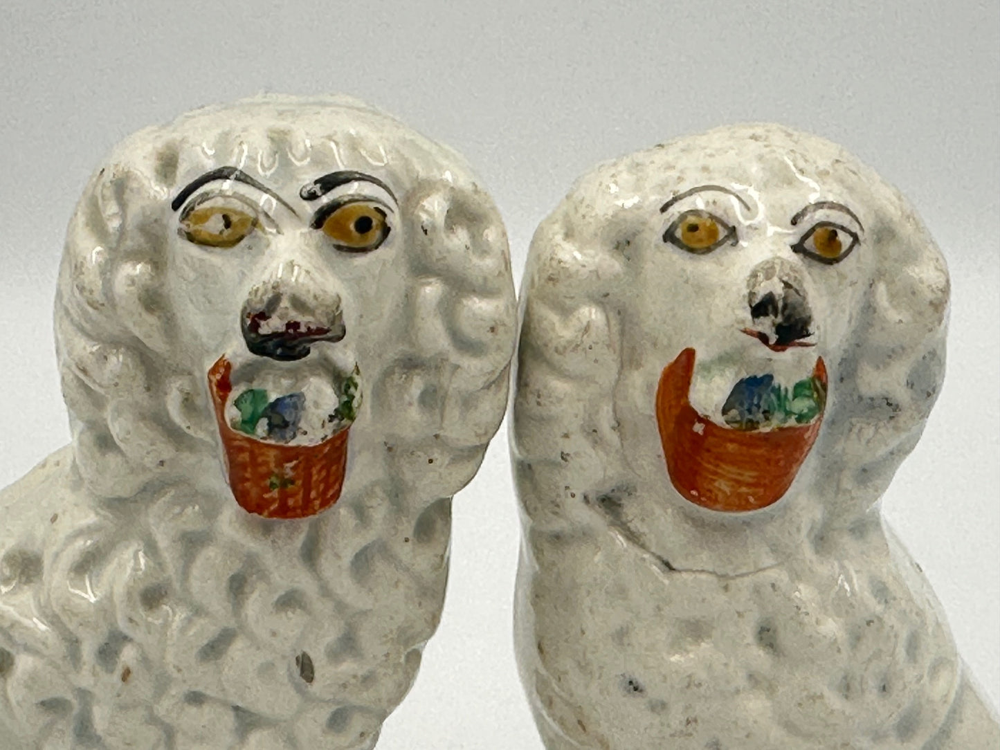 Pair of Staffordshire Poodles with Baskets