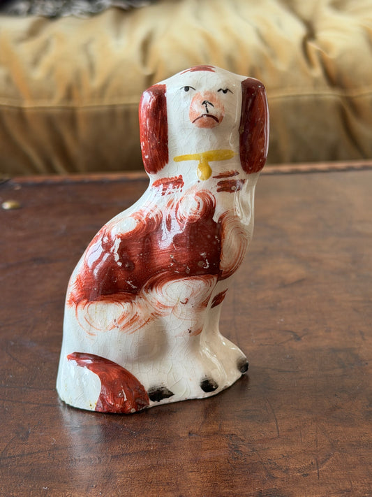 Miniature russet staffordshire spaniel with handprinted features.