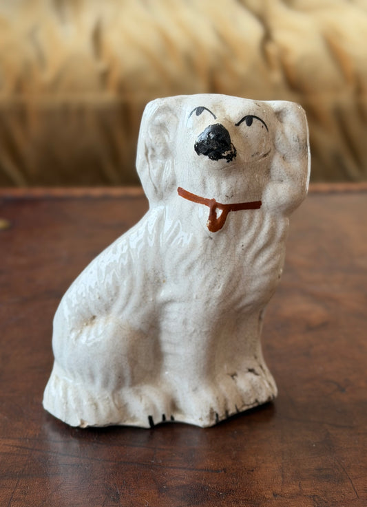 Very small Staffordshire Spaniel figurine with handpainted black facial features and collar detail. 