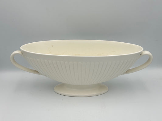 A Wedgwood white moonstone mantle vase with a ribbed and fluted design, featuring a footed base.