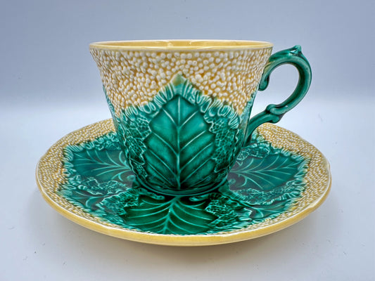 A wedgwood teacup and saucer that resembles cauliflower